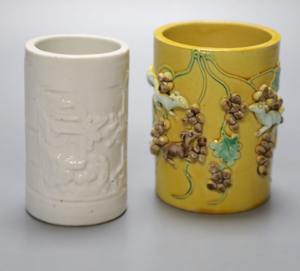 A blanc de chine brush pot together with a Chinese yellow ground brush pot, Qianlong mark but later, height 11cm